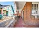 Charming front porch with red painted floor and brick detailing at 732 Cascade Sw Ave, Atlanta, GA 30310
