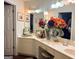 Bathroom featuring double vanity, decorative lighting, and a view into the closet at 613 Mountain Oaks Pkwy, Stone Mountain, GA 30087