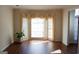 Bright room with large bay window, neutral walls, and sleek hardwood flooring at 613 Mountain Oaks Pkwy, Stone Mountain, GA 30087