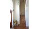 Bright foyer featuring hardwood floors, a staircase, and a decorative front door with sidelight at 613 Mountain Oaks Pkwy, Stone Mountain, GA 30087