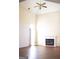 Spacious living room featuring high ceilings, a fireplace, and large windows providing ample natural light at 613 Mountain Oaks Pkwy, Stone Mountain, GA 30087