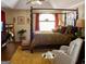 Spacious primary bedroom boasts a four-poster bed, vaulted ceiling, and neutral decor at 613 Mountain Oaks Pkwy, Stone Mountain, GA 30087