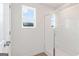 Bathroom with glass-enclosed shower and bright window at 984 Sutherland Ln # 31, Lawrenceville, GA 30043
