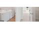 Laundry room featuring washer and dryer hookups, next to additional storage at 984 Sutherland Ln # 31, Lawrenceville, GA 30043