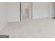 Bright bedroom with neutral carpet and white trim at 984 Sutherland Ln # 31, Lawrenceville, GA 30043