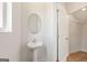 Stylish half bathroom with white fixtures and wood-look flooring at 984 Sutherland Ln # 31, Lawrenceville, GA 30043
