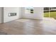 Open living room with contemporary fireplace and sliding door to yard at 984 Sutherland Ln # 31, Lawrenceville, GA 30043