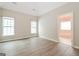 Spacious bedroom with hardwood floors and two windows, providing ample natural light at 1116 5Th Nw St, Atlanta, GA 30318