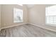 Bright bedroom showcasing luxury vinyl plank flooring and natural light from two windows at 1116 5Th Nw St, Atlanta, GA 30318