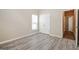 Comfortable bedroom featuring luxury vinyl plank flooring, closet, and neutral walls at 1116 5Th Nw St, Atlanta, GA 30318