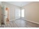 Cozy bedroom featuring luxury vinyl plank flooring, closet and a window providing natural light at 1116 5Th Nw St, Atlanta, GA 30318