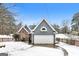 Charming home exterior featuring a two-car garage and a blend of siding and stone accents at 1116 5Th Nw St, Atlanta, GA 30318
