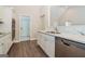 Modern kitchen featuring stainless steel appliances, white cabinets, and marble countertops at 1116 5Th Nw St, Atlanta, GA 30318