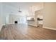 Spacious living room with hardwood floors, fireplace, and view into the bright kitchen at 1116 5Th Nw St, Atlanta, GA 30318