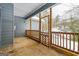 Covered porch with wooden railing and lattice work, offering a cozy outdoor space at 1116 5Th Nw St, Atlanta, GA 30318
