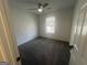 Inviting bedroom with neutral walls and a window with natural light at 607 Tramore Ct, Stockbridge, GA 30281