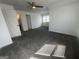 Bright bedroom with a ceiling fan, neutral walls, and large window providing natural light at 607 Tramore Ct, Stockbridge, GA 30281