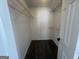 A walk-in closet featuring installed shelving for optimal storage at 607 Tramore Ct, Stockbridge, GA 30281