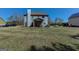 View of the home's backyard and covered patio, showcasing the outdoor space and landscaping at 4205 Lindsey Way, Conyers, GA 30013