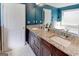 Bright bathroom featuring granite countertops, double sinks, white cabinets, and tile floors at 4205 Lindsey Way, Conyers, GA 30013