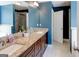 Stylish bathroom features a granite countertop vanity, a large mirror, and tiled flooring at 4205 Lindsey Way, Conyers, GA 30013