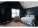 Charming bedroom features neutral carpeting, a sizable window, and a comfortable bed set against freshly painted walls at 4205 Lindsey Way, Conyers, GA 30013