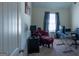 Bright bedroom featuring an office setup with comfortable seating and natural light from the window at 4205 Lindsey Way, Conyers, GA 30013