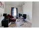 Bright bedroom featuring an office setup with comfortable seating and natural light from the window at 4205 Lindsey Way, Conyers, GA 30013