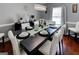 Well-lit dining room with a modern table setting, elegant chairs, and a contemporary chandelier at 4205 Lindsey Way, Conyers, GA 30013