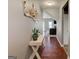 Welcoming foyer with hardwood floors, console table, and a view into the living room at 4205 Lindsey Way, Conyers, GA 30013