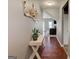 Elegant entryway with hardwood floors, decorative console table, and inviting living space view at 4205 Lindsey Way, Conyers, GA 30013