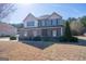 Charming two-story home featuring a stone facade and well-manicured landscaping at 4205 Lindsey Way, Conyers, GA 30013