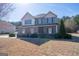 Beautiful two-story home featuring stone accents, neutral siding, and a well-maintained front lawn at 4205 Lindsey Way, Conyers, GA 30013