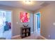 Hallway leading to bedrooms, showing neutral carpet, decorative accents, and doorway views at 4205 Lindsey Way, Conyers, GA 30013