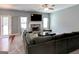 Spacious living room featuring a fireplace, large sectional sofa, and plenty of natural light at 4205 Lindsey Way, Conyers, GA 30013