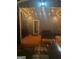 Nighttime view of covered patio with string lights, seating, and stone pathway at 4205 Lindsey Way, Conyers, GA 30013