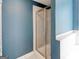 Modern walk-in shower featuring seamless glass doors, updated fixtures, and beautiful tile work at 4205 Lindsey Way, Conyers, GA 30013