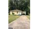 Charming single-story home with a well-maintained lawn and a private driveway at 3720 Asbury Sw Ln, Atlanta, GA 30331