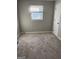 Inviting bedroom with neutral carpet, and a bright window create a relaxing space at 30 Lemon Pl, Mcdonough, GA 30253