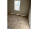 Comfortable bedroom with neutral carpet and natural light from the bright window at 30 Lemon Pl, Mcdonough, GA 30253