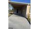 Covered carport with newly painted driveway offers sheltered parking and easy access at 30 Lemon Pl, Mcdonough, GA 30253