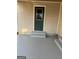 Covered entryway with newly painted concrete steps offers sheltered entry to the home at 30 Lemon Pl, Mcdonough, GA 30253