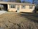 Charming single-story home with tan siding, green shutters, and a covered carport at 30 Lemon Pl, Mcdonough, GA 30253