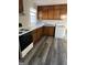 Functional kitchen features wood cabinets, laminate countertop, and convenient appliances at 30 Lemon Pl, Mcdonough, GA 30253