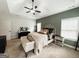This primary bedroom features a tray ceiling with fan, neutral walls and an ensuite bathroom at 9178 Lakeview Pkwy, Villa Rica, GA 30180