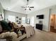 This primary bedroom features neutral walls, carpet floors, and an ensuite bathroom at 9178 Lakeview Pkwy, Villa Rica, GA 30180