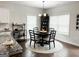 Cozy dining area with elegant table set and natural light from large windows at 9178 Lakeview Pkwy, Villa Rica, GA 30180