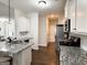 Bright kitchen with granite counters, white cabinets, and stainless steel appliances at 9178 Lakeview Pkwy, Villa Rica, GA 30180