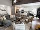 Open-concept living room flows into the modern kitchen and dining area at 9178 Lakeview Pkwy, Villa Rica, GA 30180