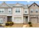 Charming townhome with a brick facade, attached garage, and well-maintained landscaping at 2271 Rolling Trl, Lithonia, GA 30058